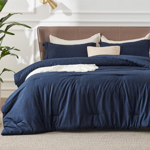 Bedsure navy blue queen comforter ensemble on bed showing all season softness