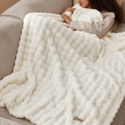 Bedsure off-white blanket complements neutral living room decor palettes.