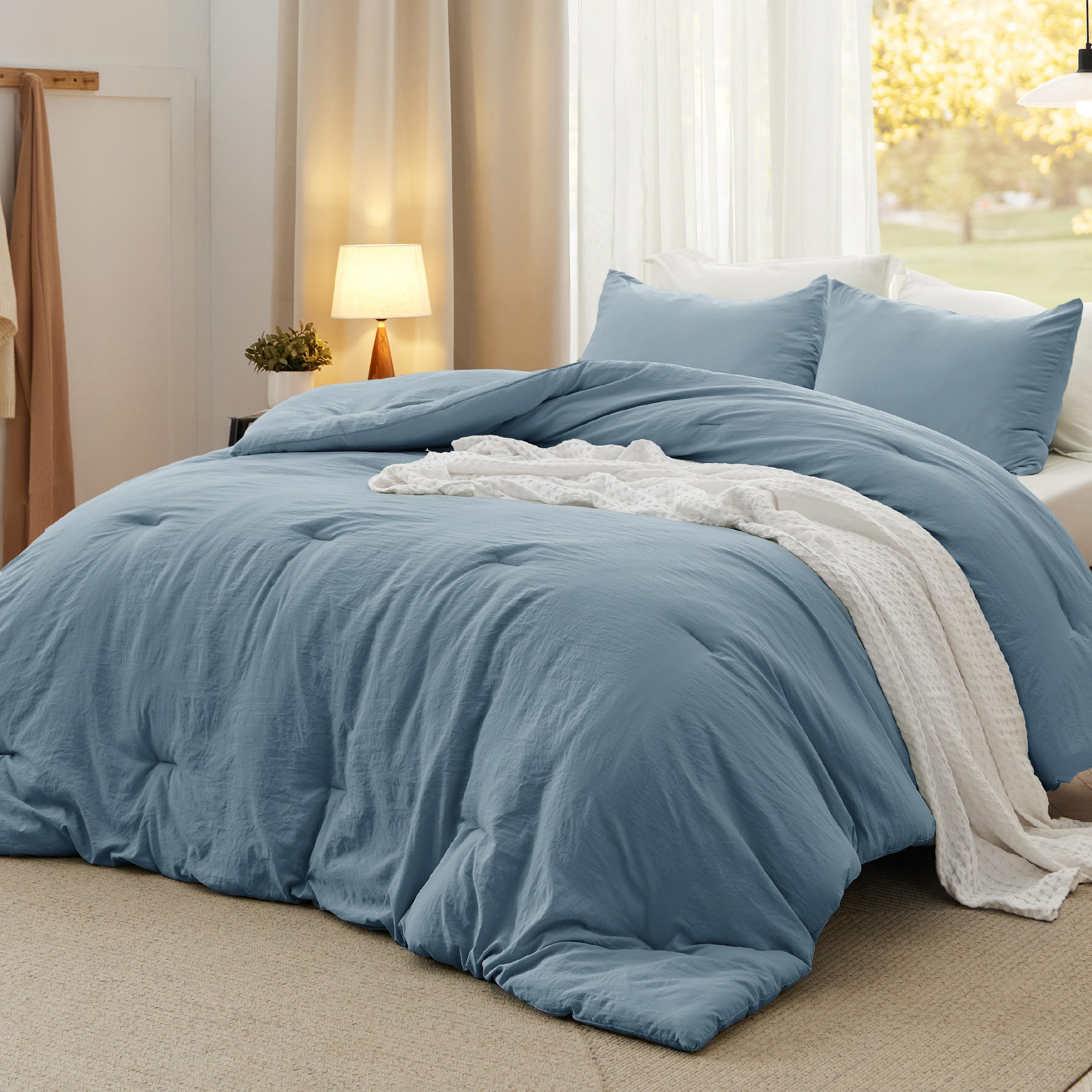 Bedsure oversized king comforter in dusty blue for year-round softness