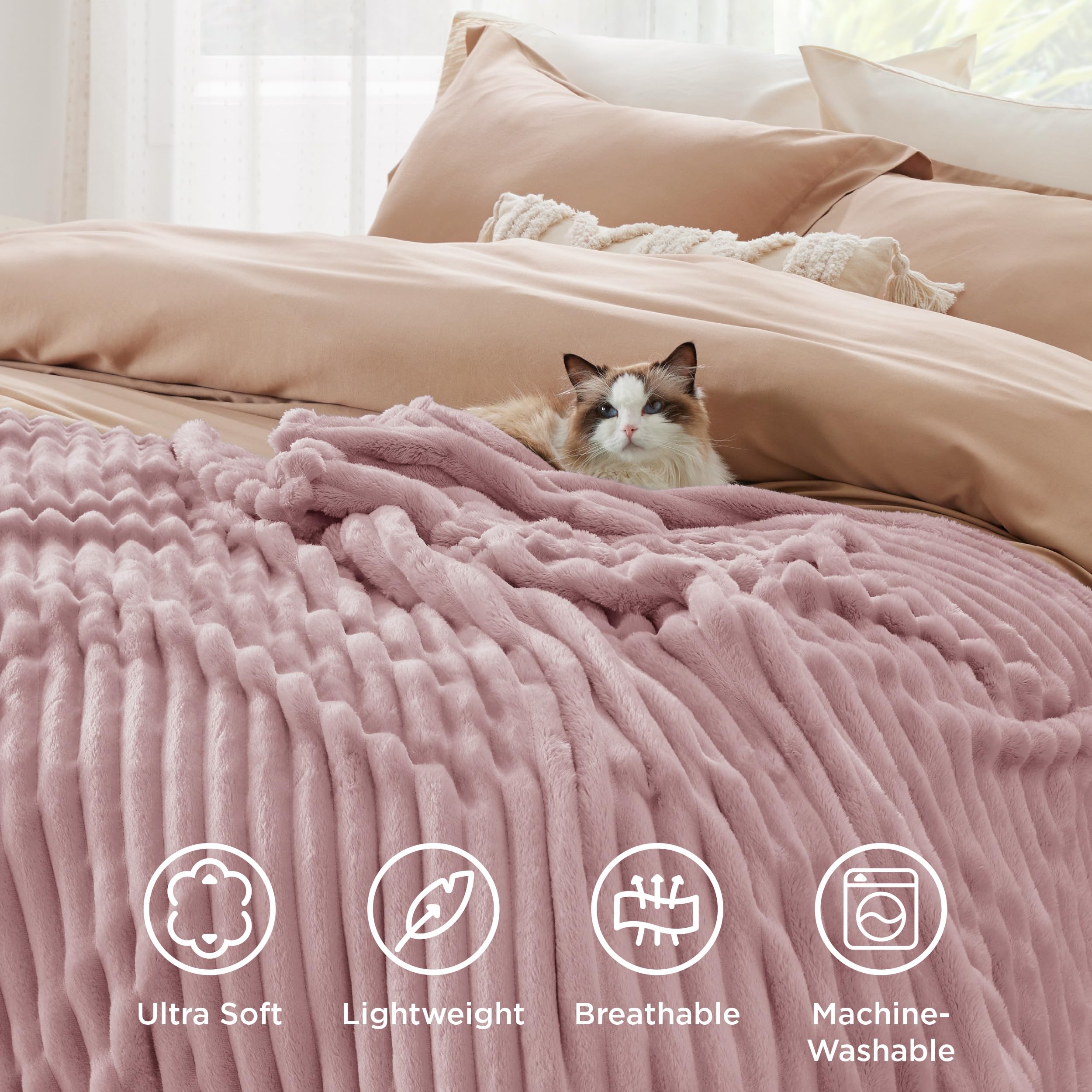 Bedsure pink decor blanket on couch ideal for cozy movie nights.