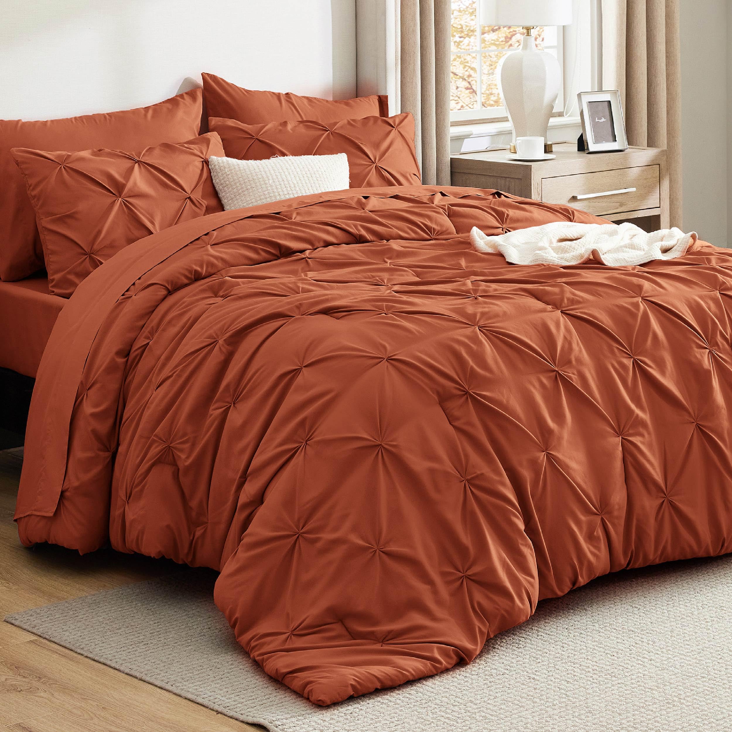 Bedsure queen comforter in burnt orange showcases pintuck detailing for a plush, inviting bed