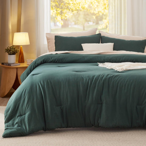 Bedsure forest green comforter folded neatly, ready to refresh your space.