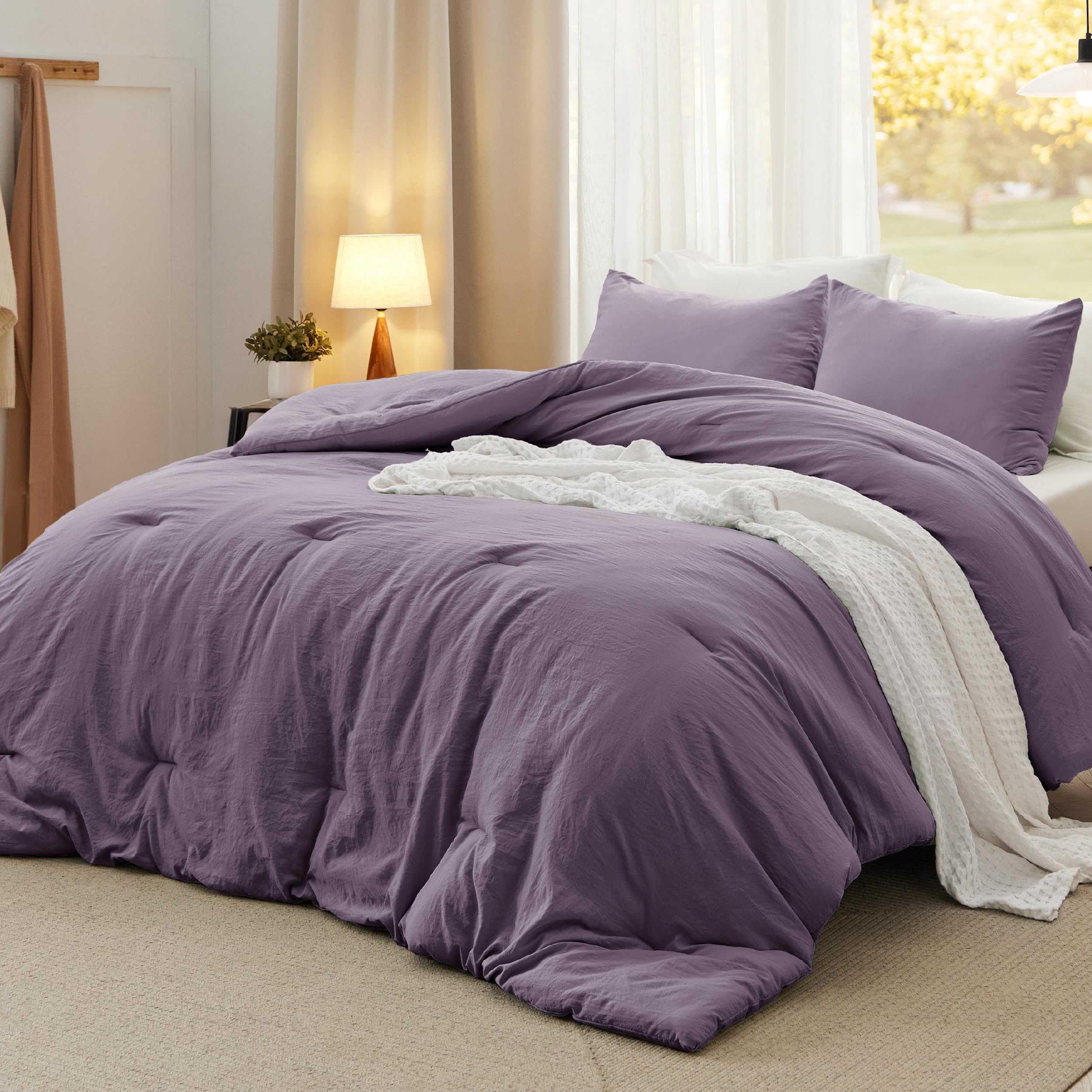 Bedsure queen comforter set in grayish purple close-up shows soft, breathable fabric.
