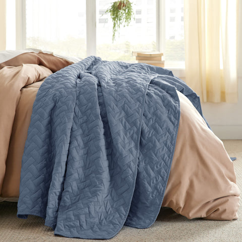 Bedsure quilt on a bed with pets nearby, cozy setup