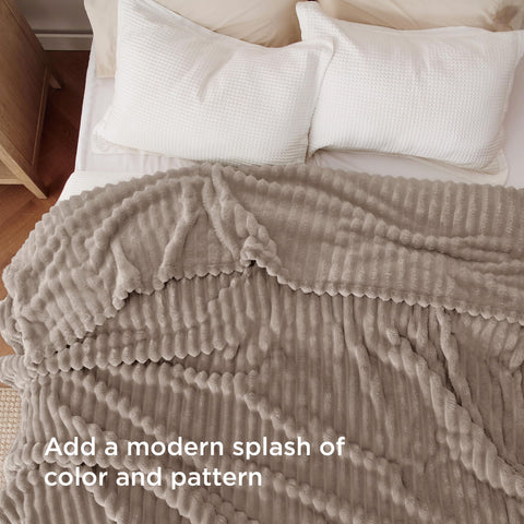 Bedsure soft blanket folded neatly for bed or sofa snuggling.
