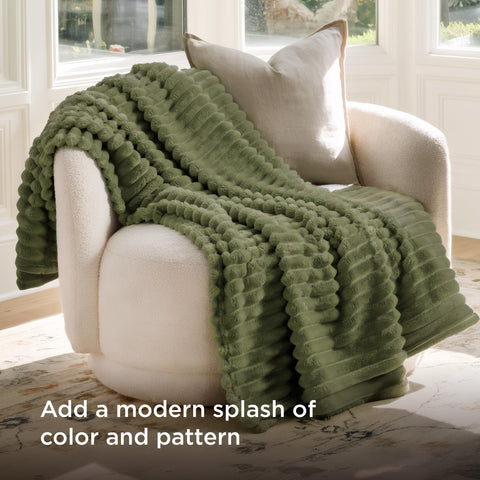 Bedsure stripe-pattern fleece blanket on couch adds subtle room texture.