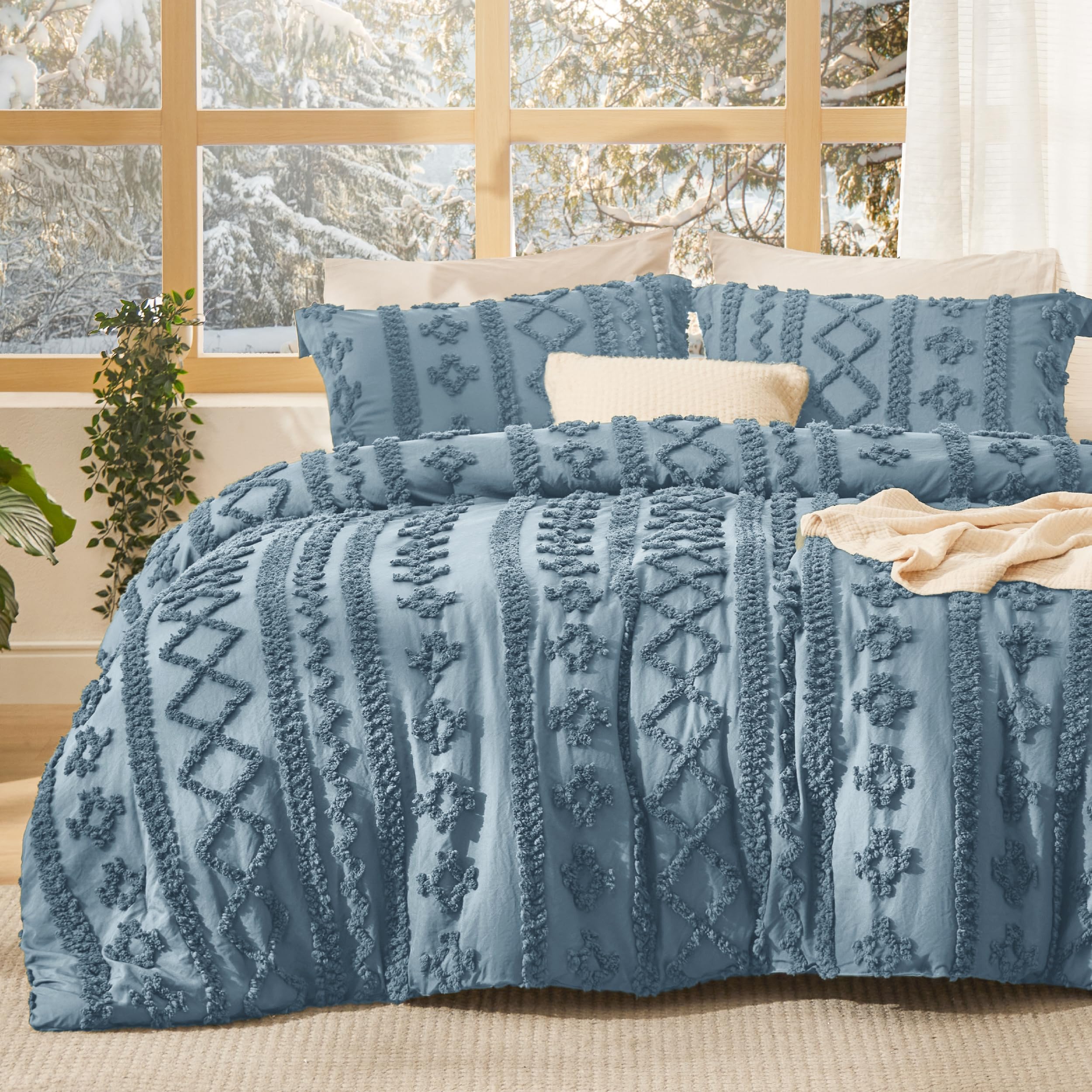 Bedsure tufted boho comforter in dusty blue closeup showing rich embroidery and texture.