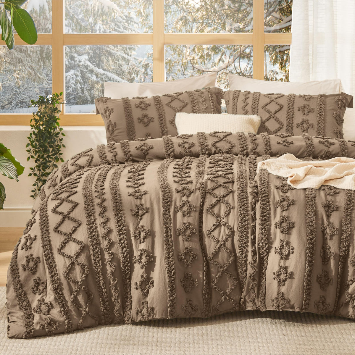 Bedsure tufted boho comforter closeup shows 3D embroidery and refined texture.