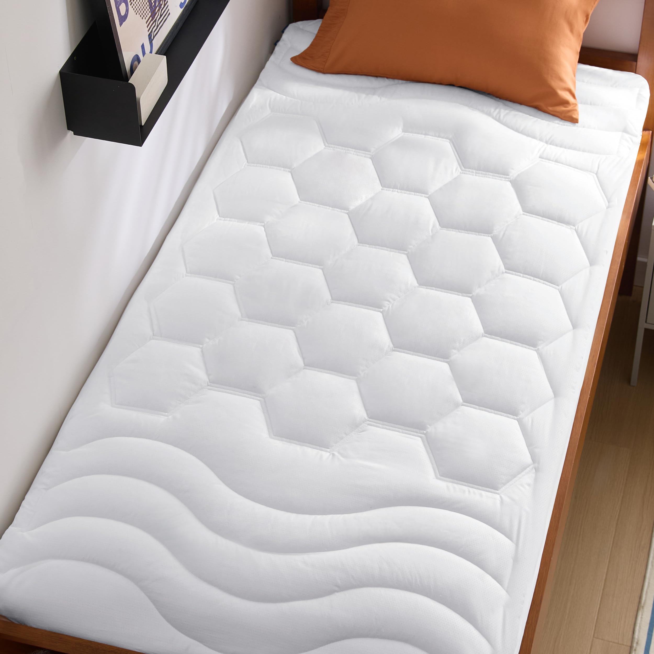 Bedsure twin mattress pad with soft brushed cover for quiet nights.