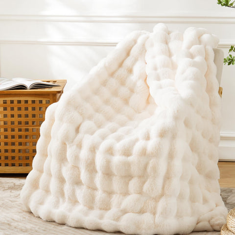 BENVWE faux fur throw blanket with bubble texture on sofa for cozy lounging