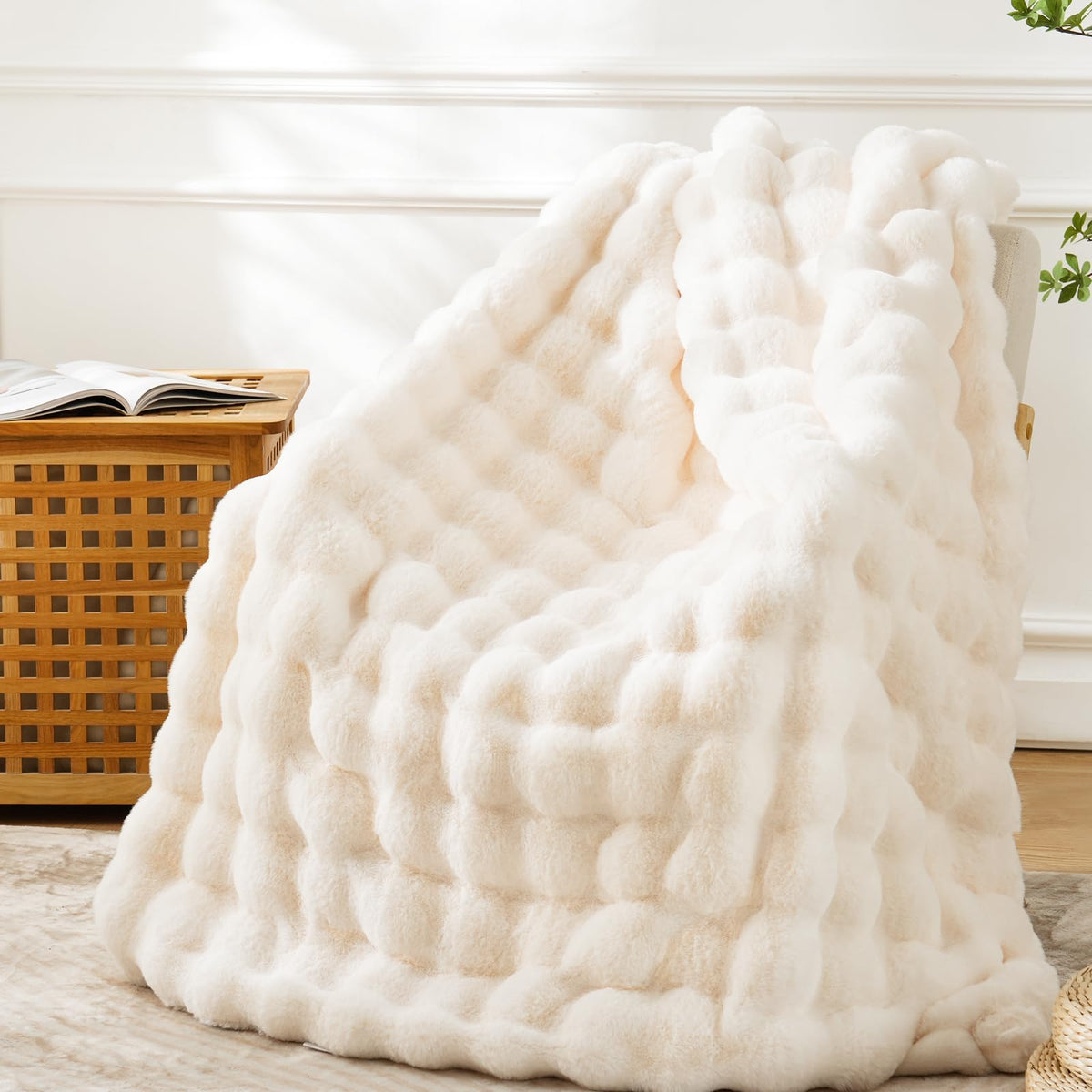 BENVWE faux fur throw with bubble texture adds cozy cream warmth to the couch