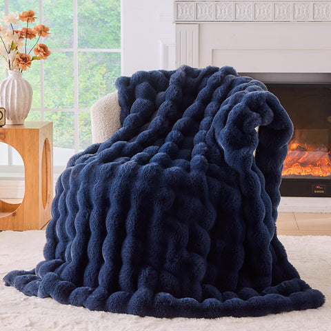 BENVWE fluffy faux fur throw on couch delivers cozy warmth and sophisticated style.
