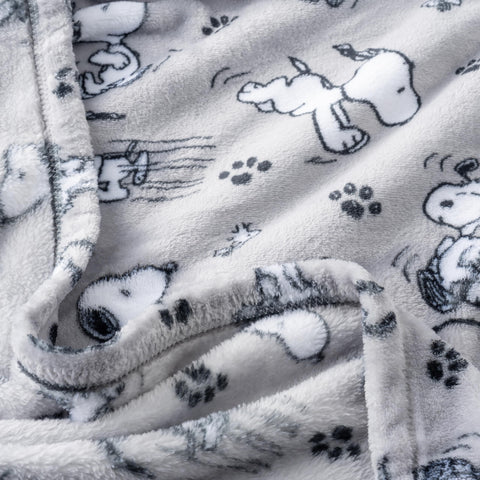 Berkshire Blanket Peanuts grey VelvetLoft weave highlights soft, breathable warmth for lounging.
