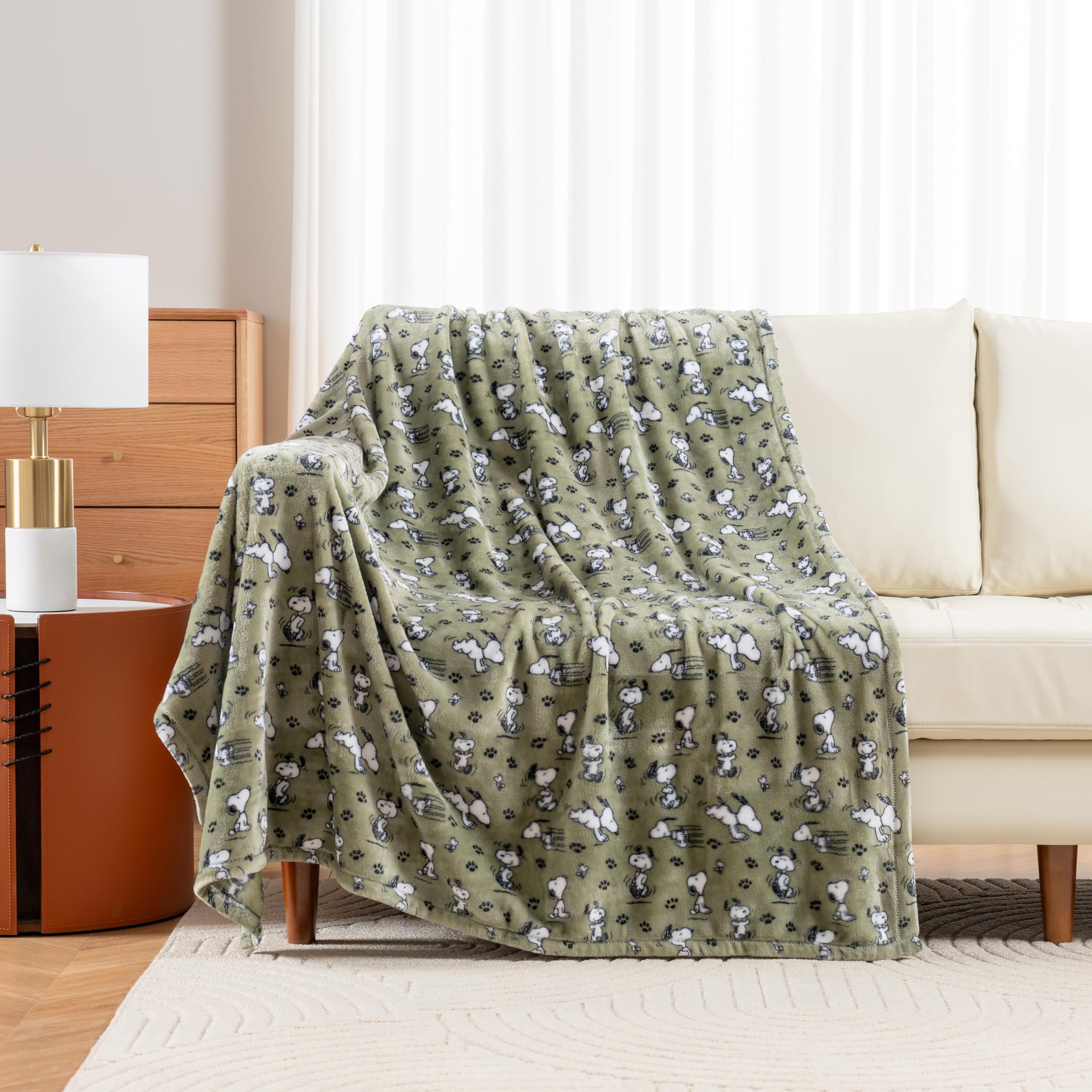 Berkshire Blanket Snoopy poses and paws artwork for playful living rooms.