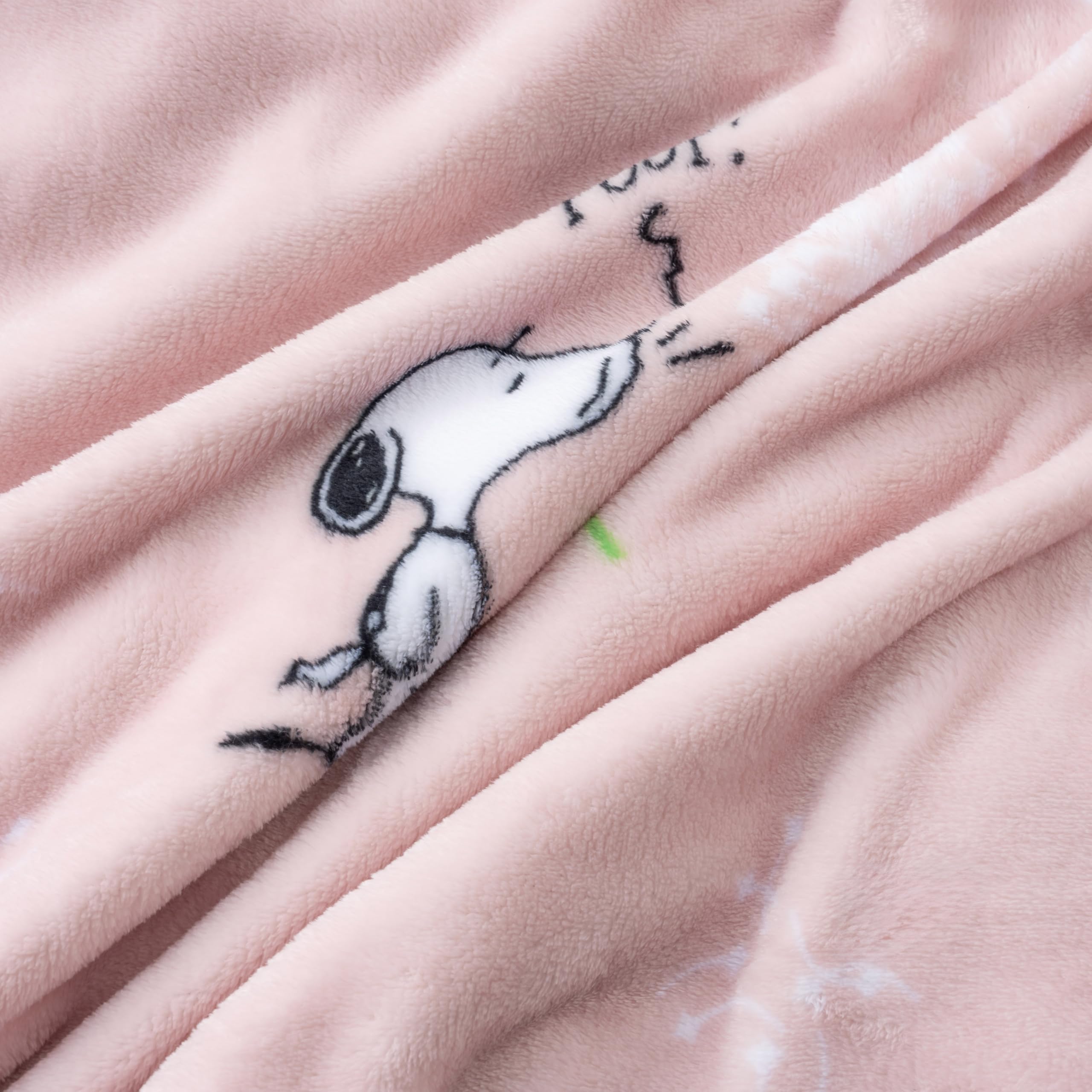 Snoopy throw size label shows 55x70 inches for full-body drape.
