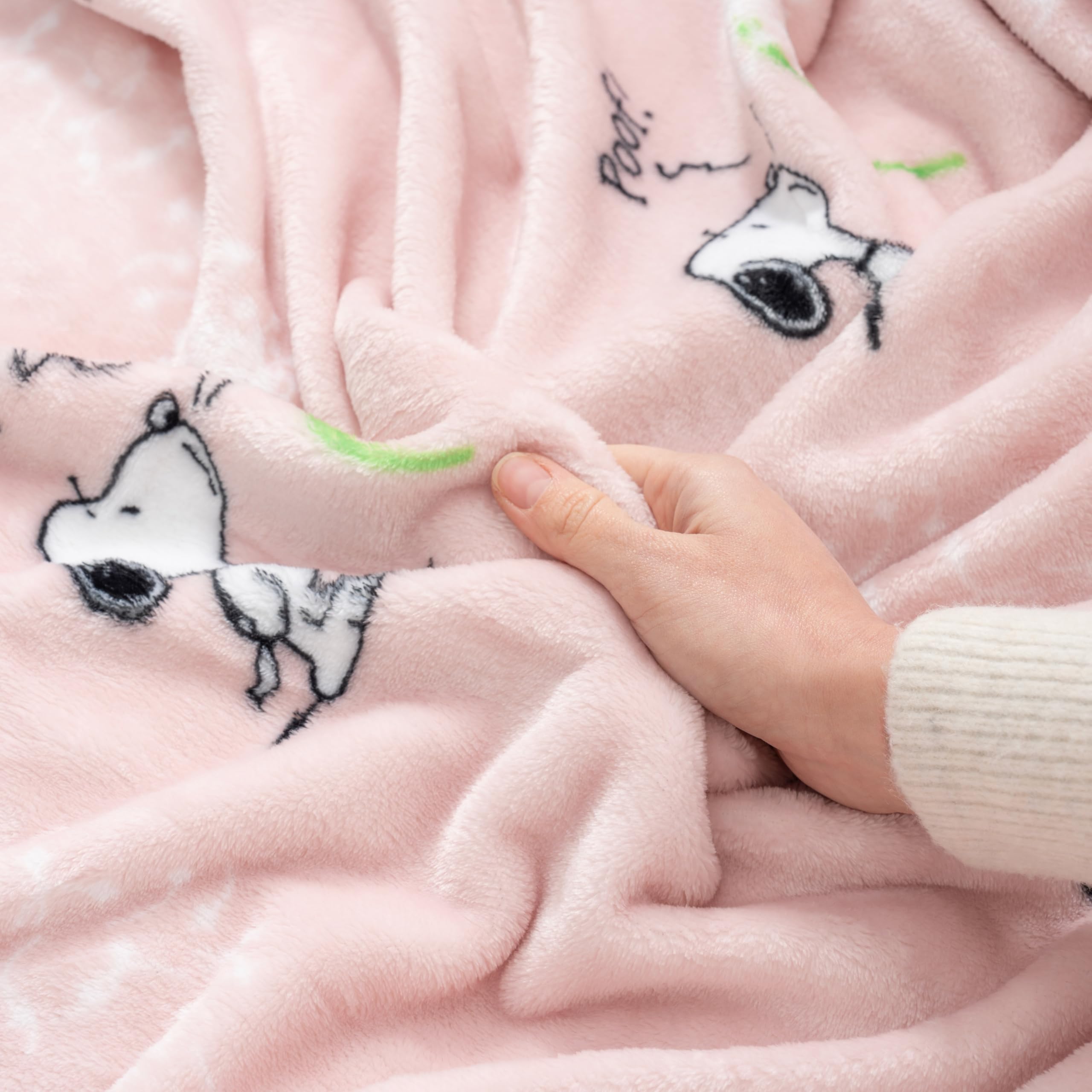 Kids enjoy Berkshire Blanket Peanuts VelvetLoft Snoopy throw during movie night.