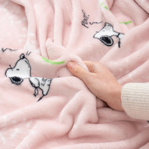 Kids enjoy Berkshire Blanket Peanuts VelvetLoft Snoopy throw during movie night.