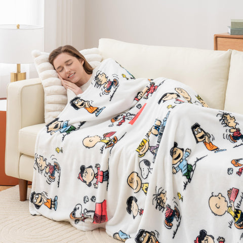 Berkshire Blanket VelvetLoft Peanuts Snoopy Throw paws scene, comforting texture ideal for family cuddles.