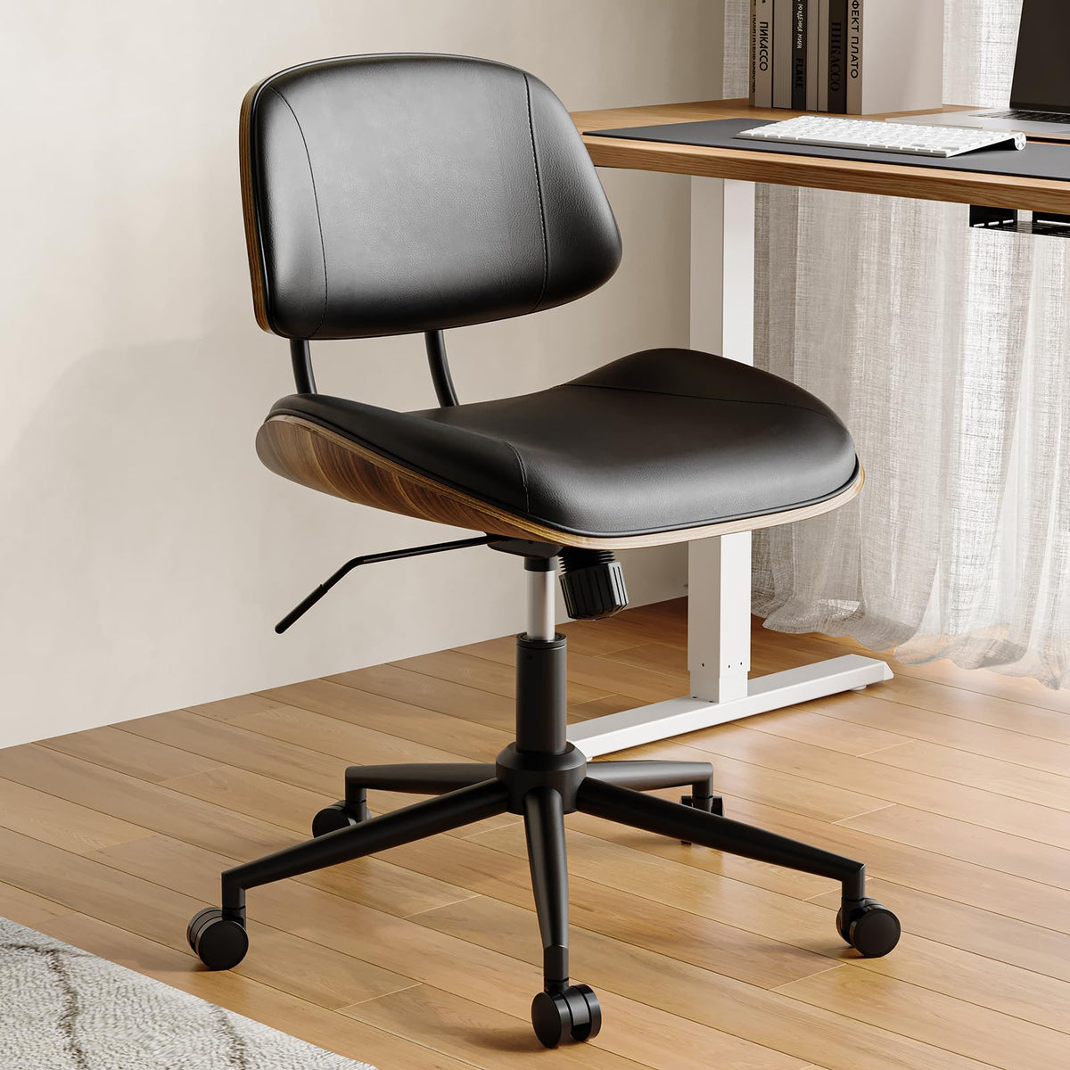 BERYTH armless office chair with wheels, front view showing mobility for small spaces