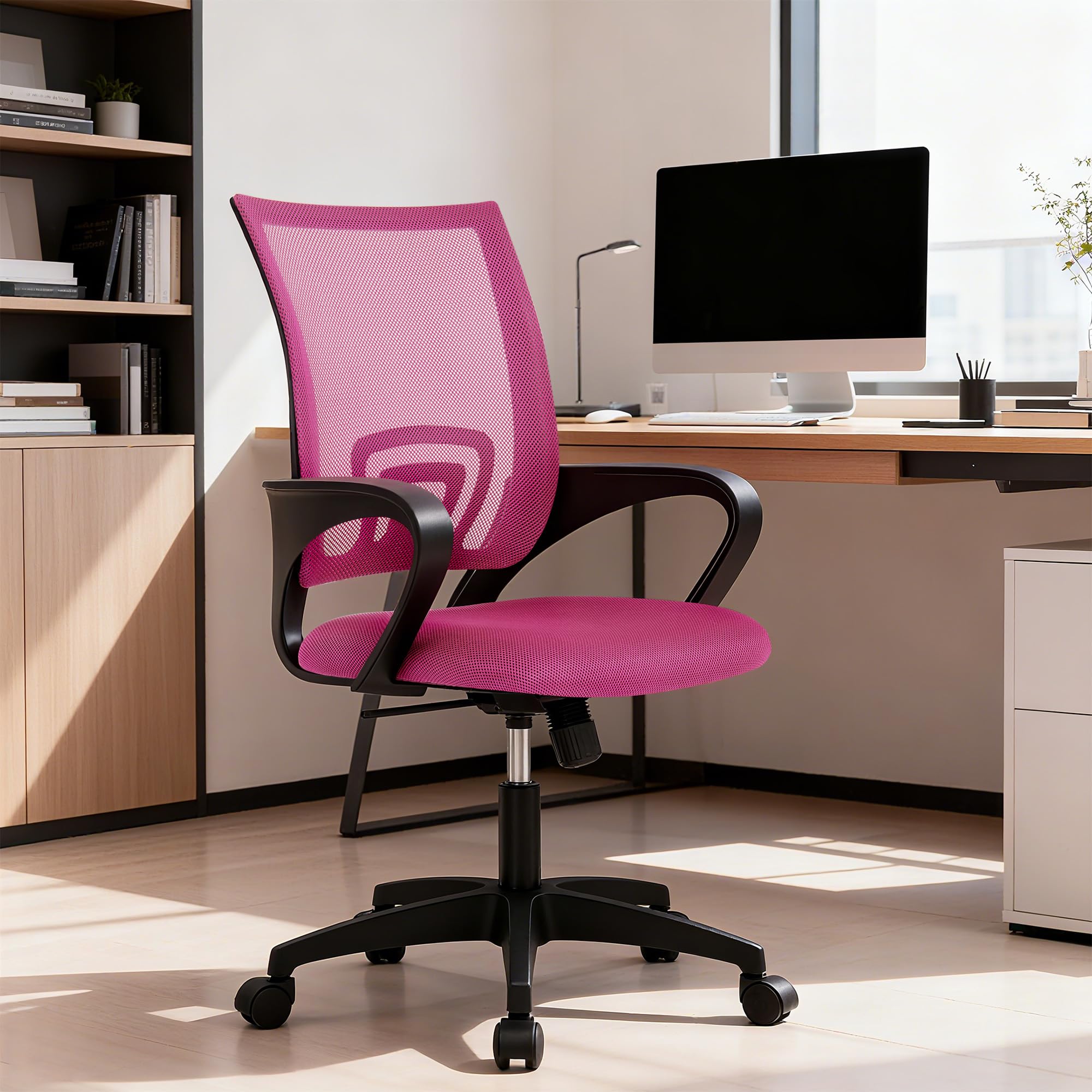 Peach pink chair adds a soft, modern accent to any home office.