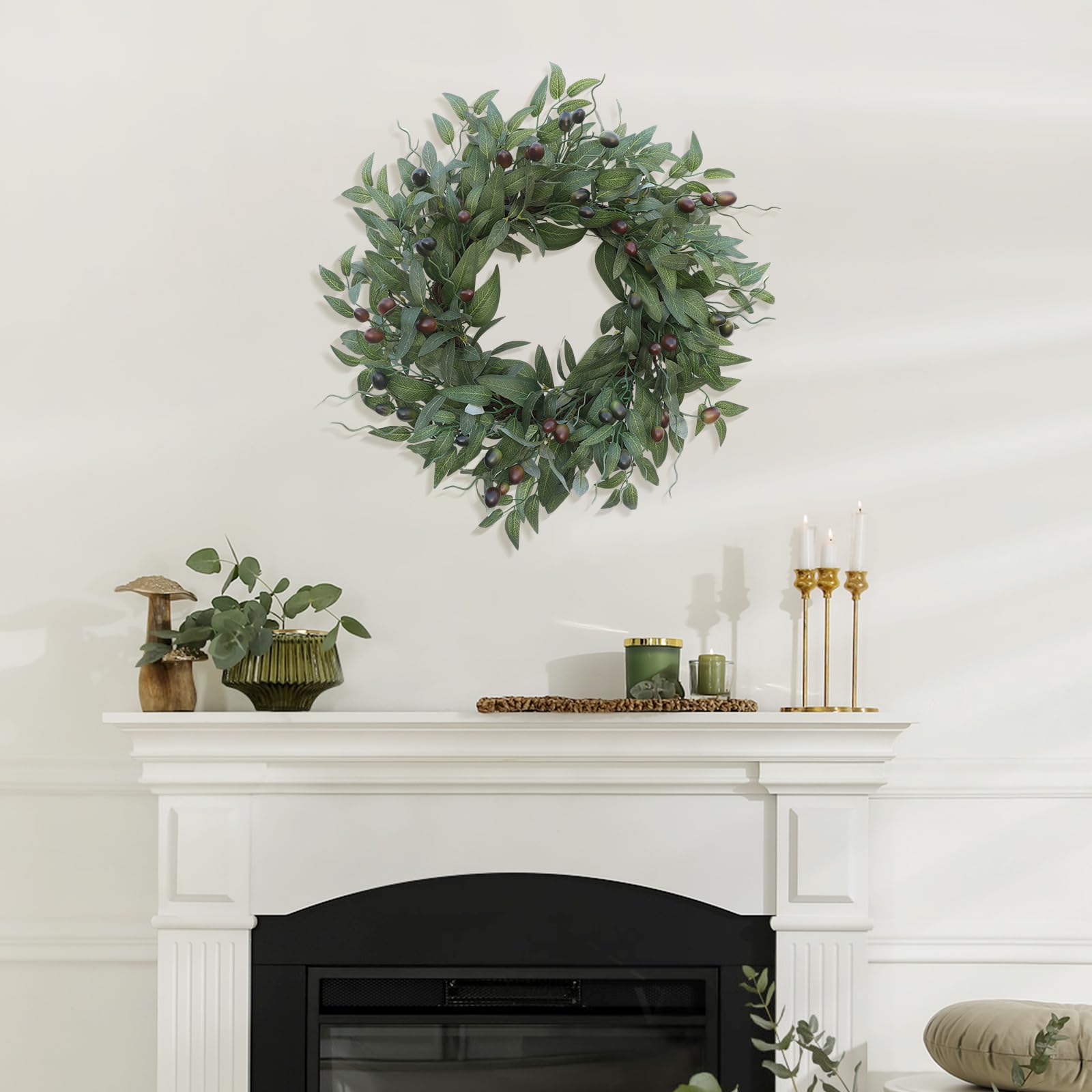BHHDA olive wreath complements living room decor across seasons.