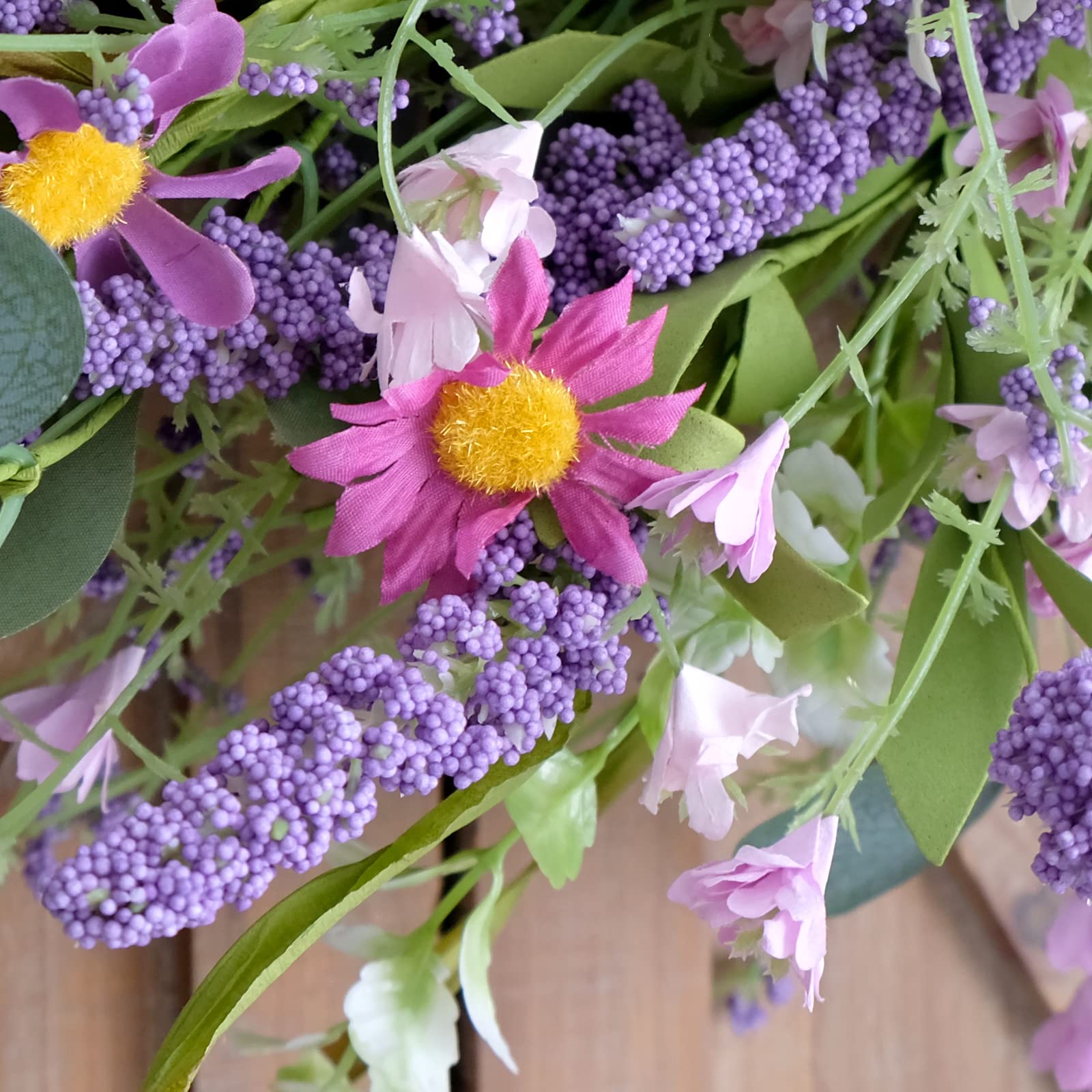 Bibelot 22-inch wreath brings year-round decor versatility for windows and walls.