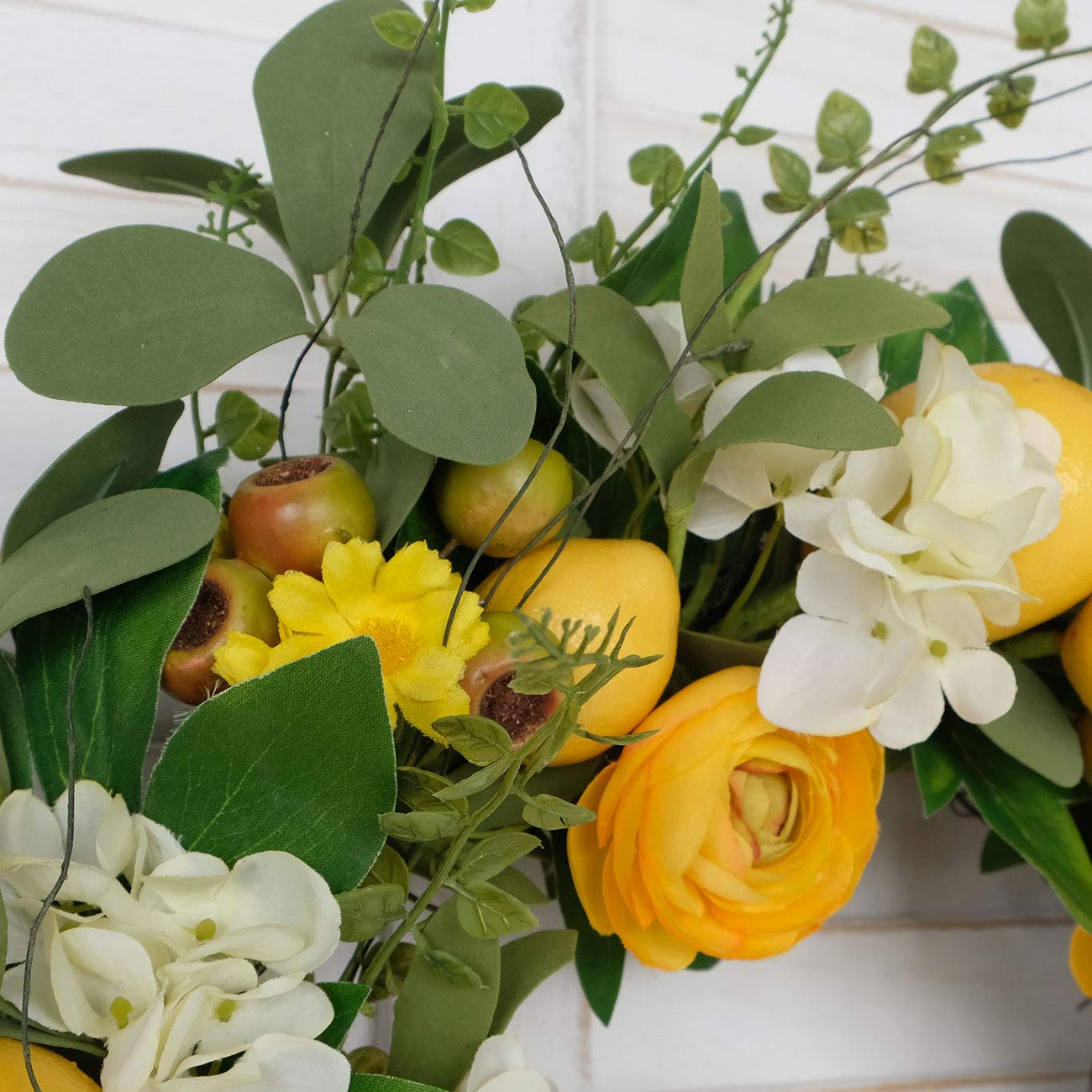 Bibelot wreath suits wall, window, or fireplace embellishment.