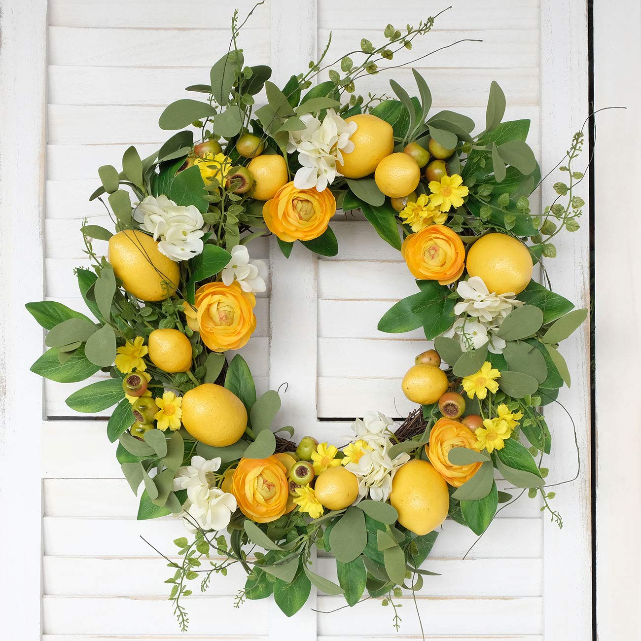 Bibelot yellow lemons and peony blooms brighten porch décor.