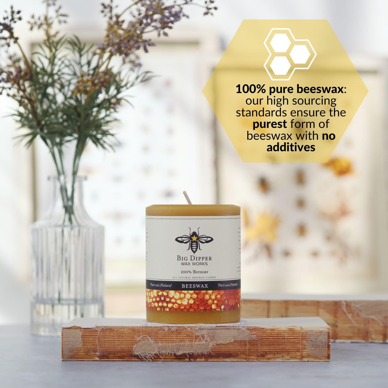 Big Dipper Wax Works beeswax pillar candle in living room, adding warm honey scent.