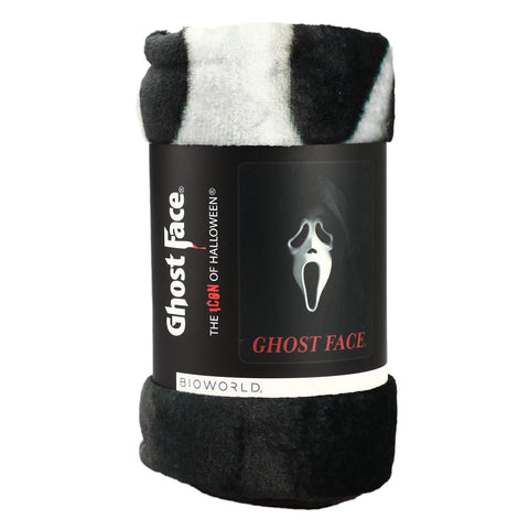 Bioworld Ghost Face Throw Blanket folded on couch for warm, inviting decor.