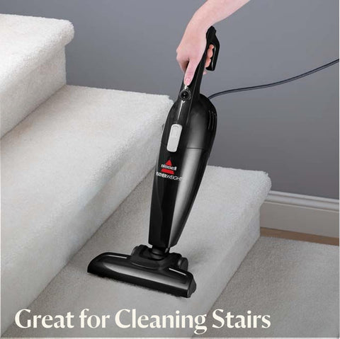 Bissell 2033M Featherweight on hard floor demonstrates efficient debris pickup.