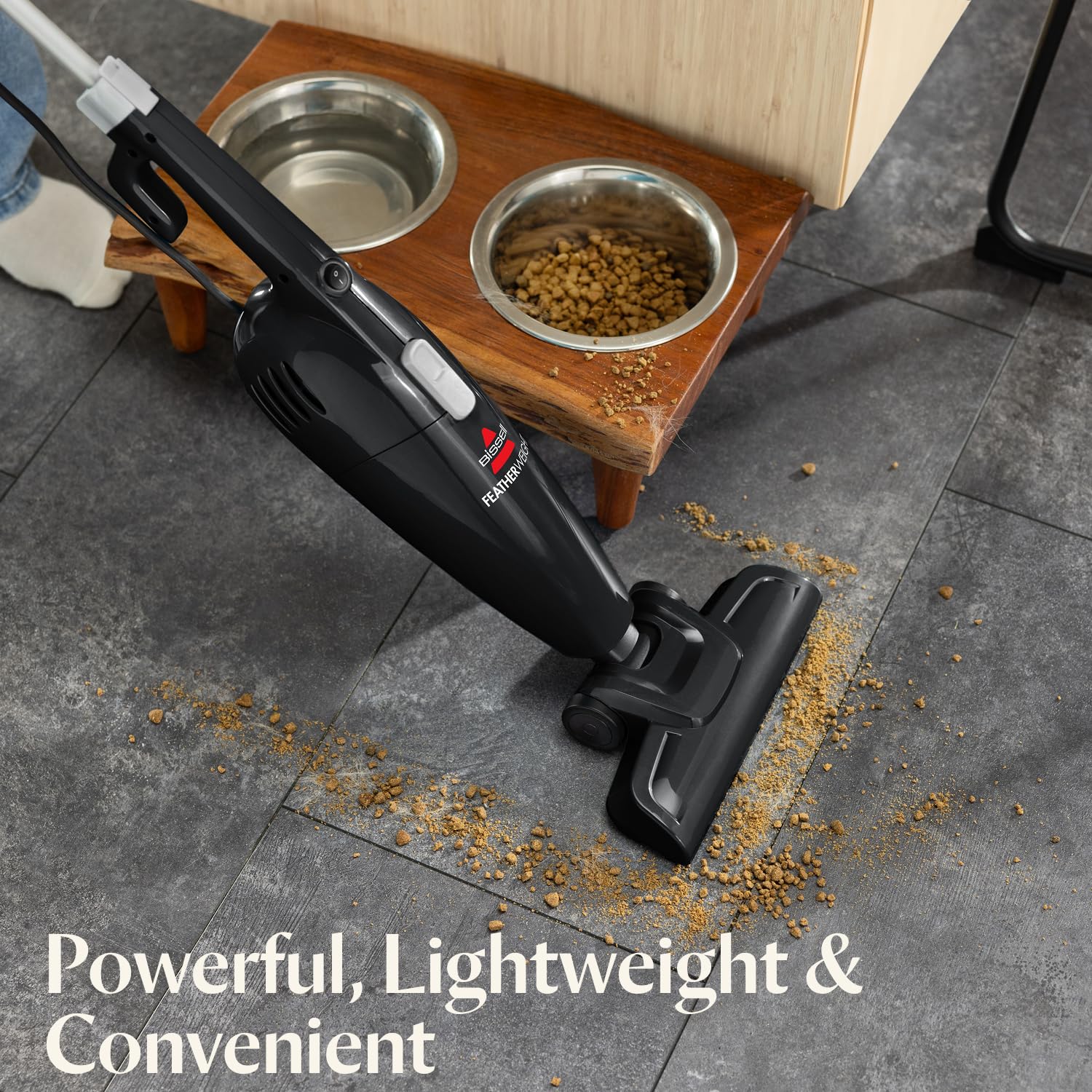 Bissell 2033M Featherweight side handle highlights ergonomic grip for effortless extended cleaning.