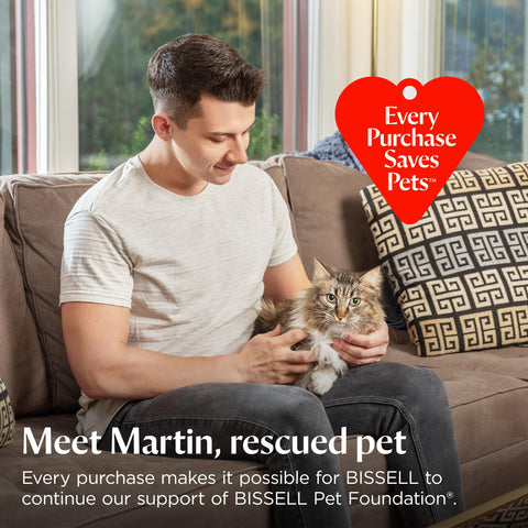 Bissell CleanView Max in action with pets on living room floor