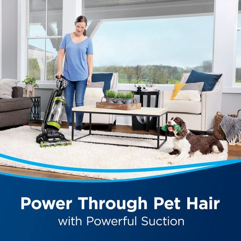 Bissell CleanView Swivel Pet Upright Vacuum illustrates edge-to-edge cleaning along baseboards and corners.