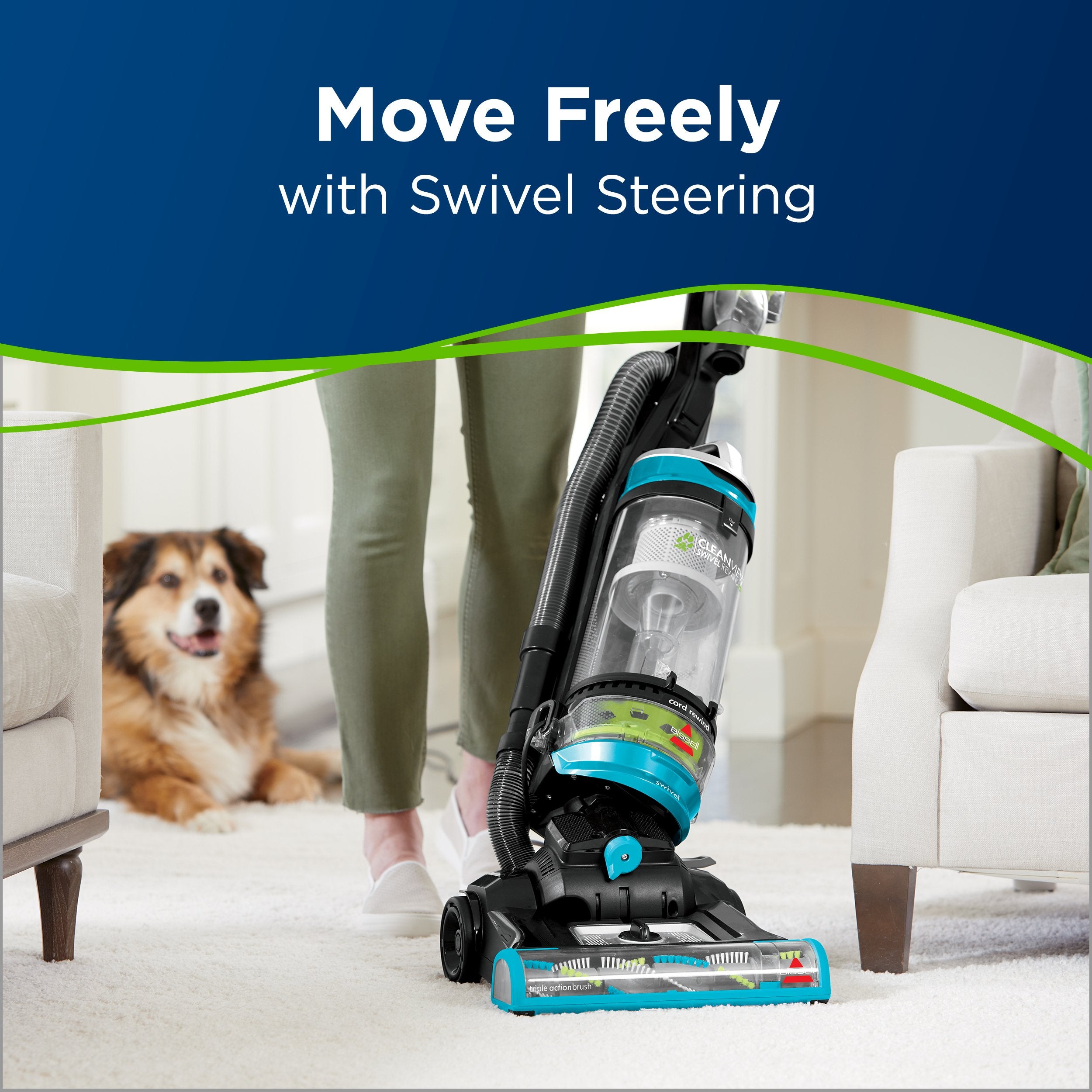Bissell CleanView Swivel Rewind Pet upright with onboard pet tools in use.