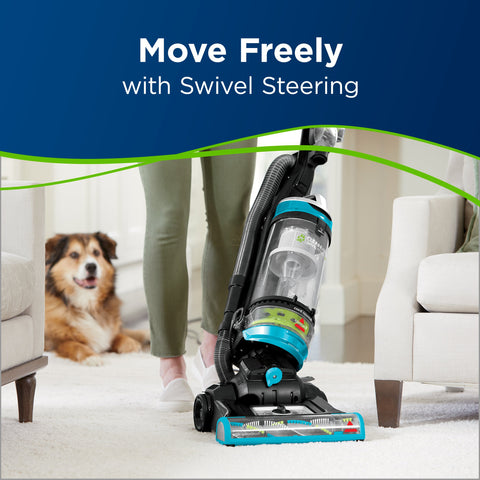 Bissell CleanView Swivel Rewind Pet upright with onboard pet tools in use.