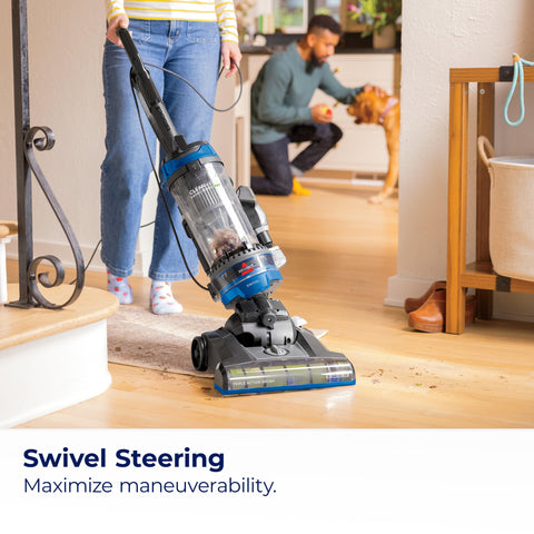 Bissell CleanView Swivel Rewind shows the triple action brush lifting dirt