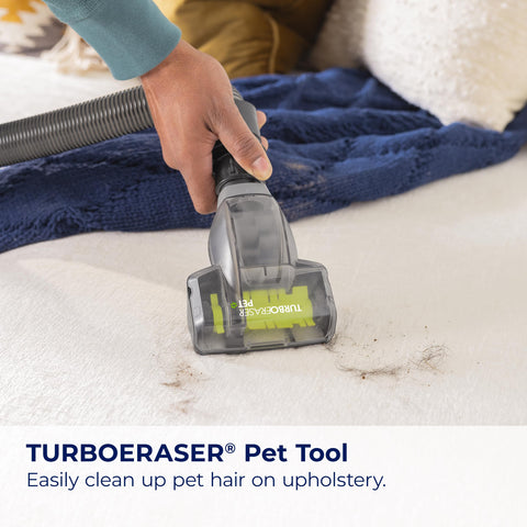 Bissell CleanView Swivel Rewind TurboEraser tool on upholstery
