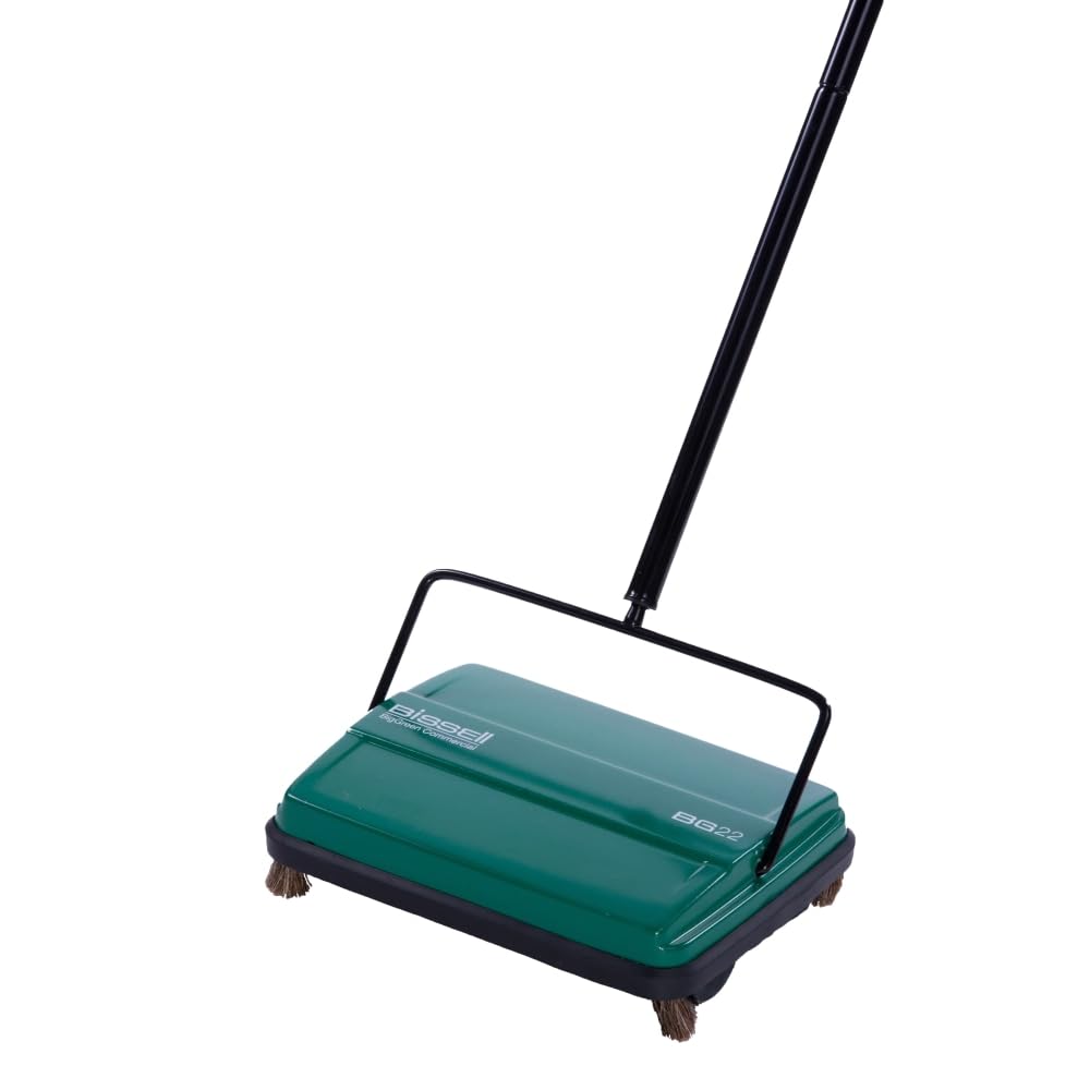 Bissell Commercial BG22 manual sweeper with 6.5-inch cleaning path for quick cleanup in busy spaces.