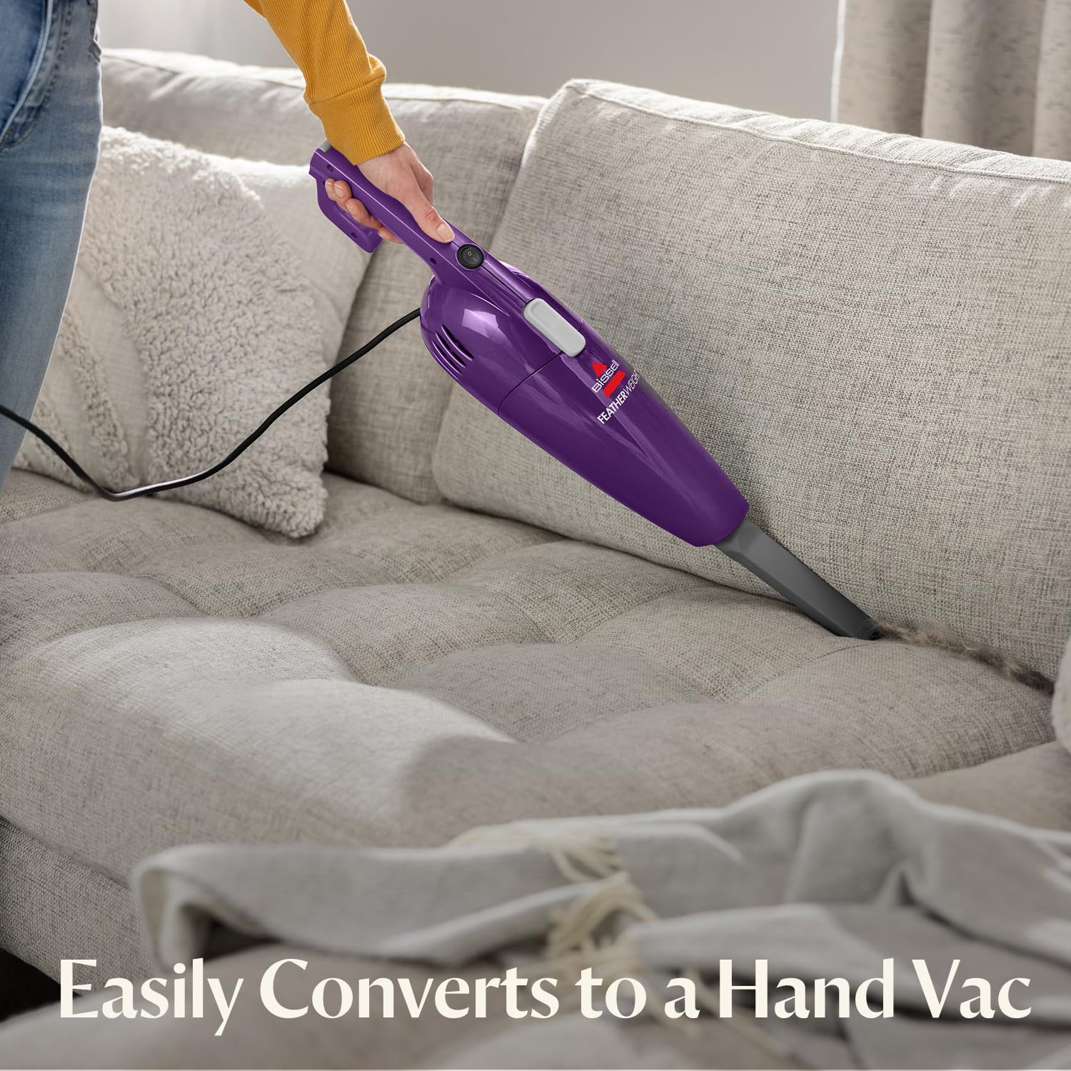 Bissell FeatherWeight stick vacuum cleaning low-pile carpets and area rugs