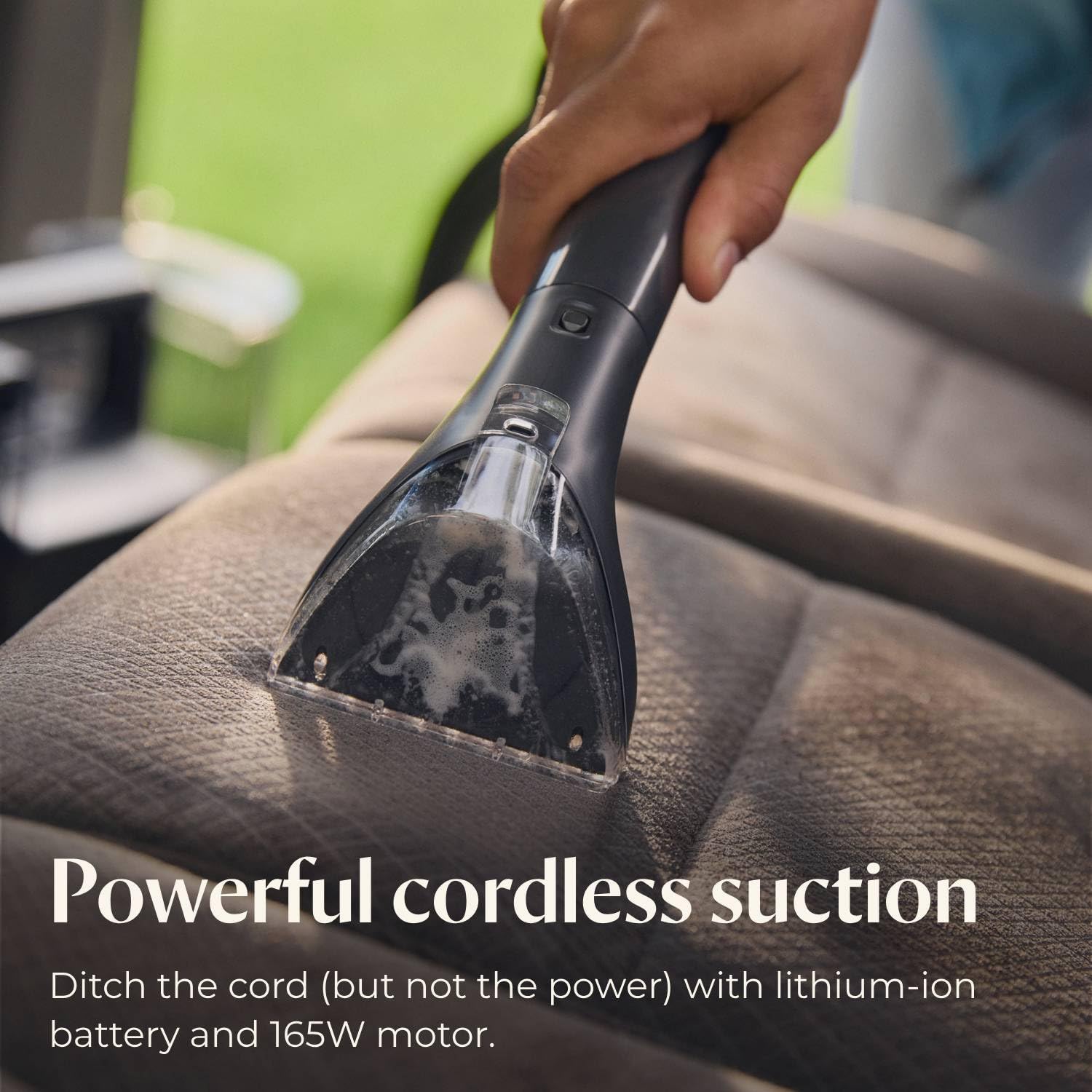 Bissell Little Green Cordless in action lifting upholstery stains