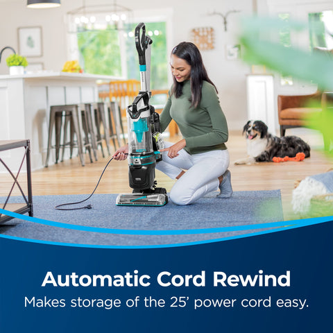 Bissell MultiClean Allergen Pet Rewind demonstrating automatic cord rewind for tidy storage