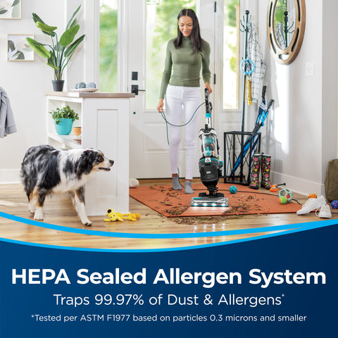 Bissell MultiClean Allergen Pet Rewind with LED headlights illuminating dirt in a corner