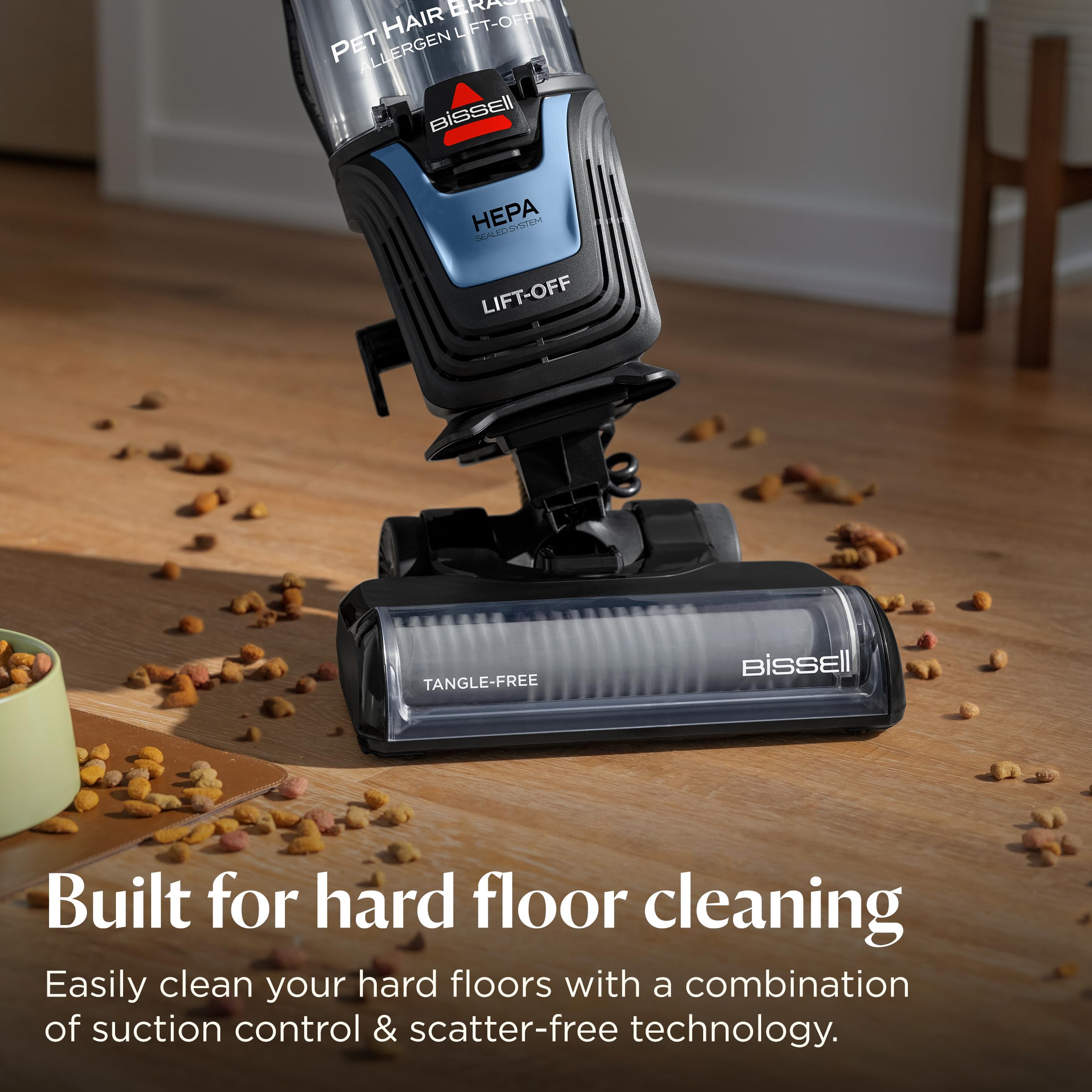 Bissell Pet Hair Eraser extension wand reaching high corners for thorough cleaning.