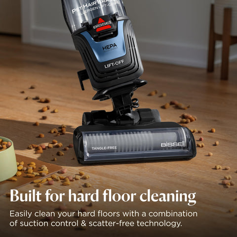 Bissell Pet Hair Eraser extension wand reaching high corners for thorough cleaning.