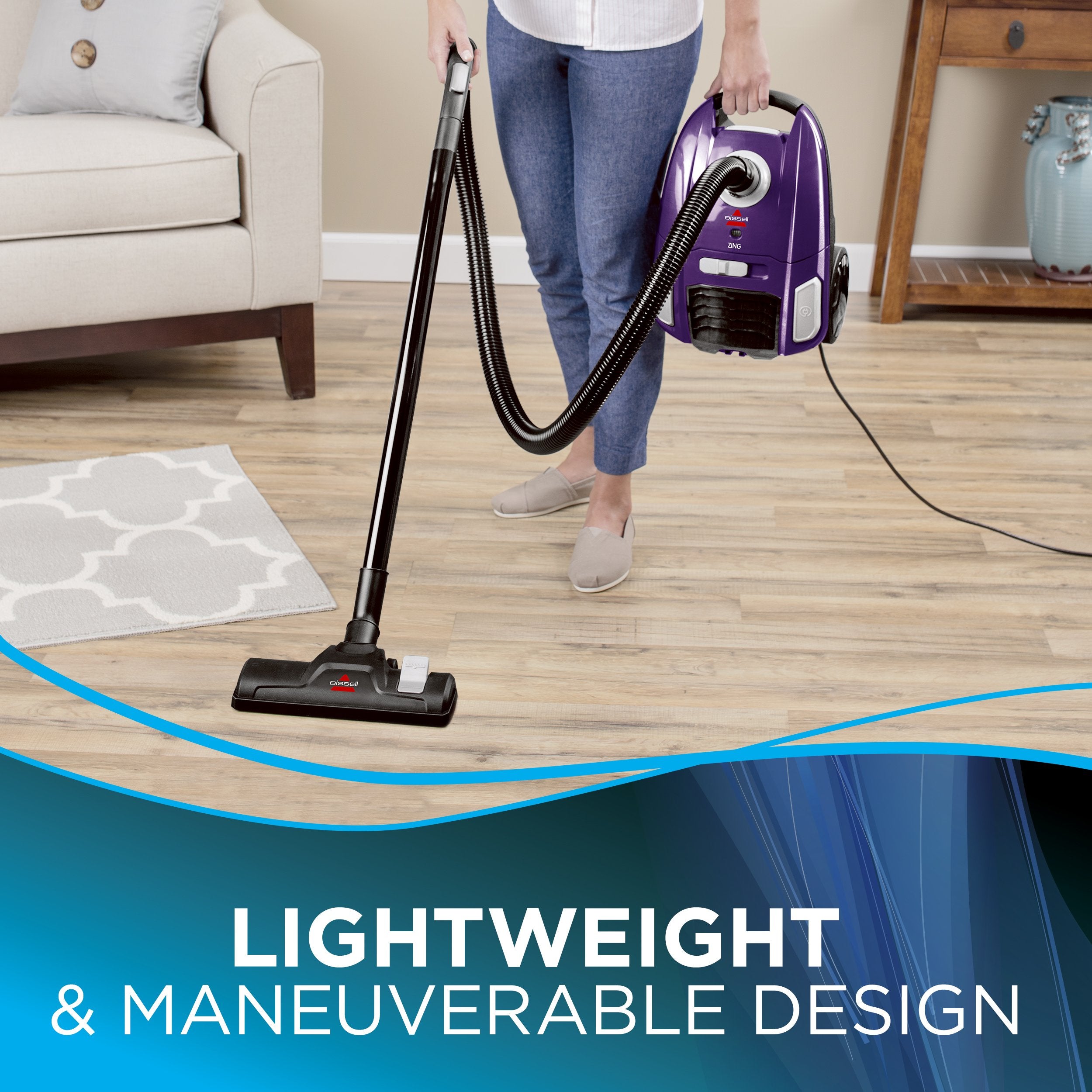 Bissell Zing bagged canister vacuum purple filter and bag close-up for easy maintenance.