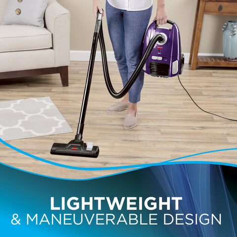 Bissell Zing bagged canister vacuum purple filter and bag close-up for easy maintenance.
