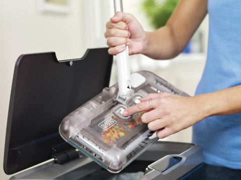 One-handed cleaning with BLACK+DECKER carpet sweeper for quick messes.