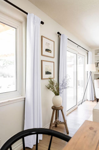 Room darkened ambiance created by 100% Blackout Shield linen curtains.