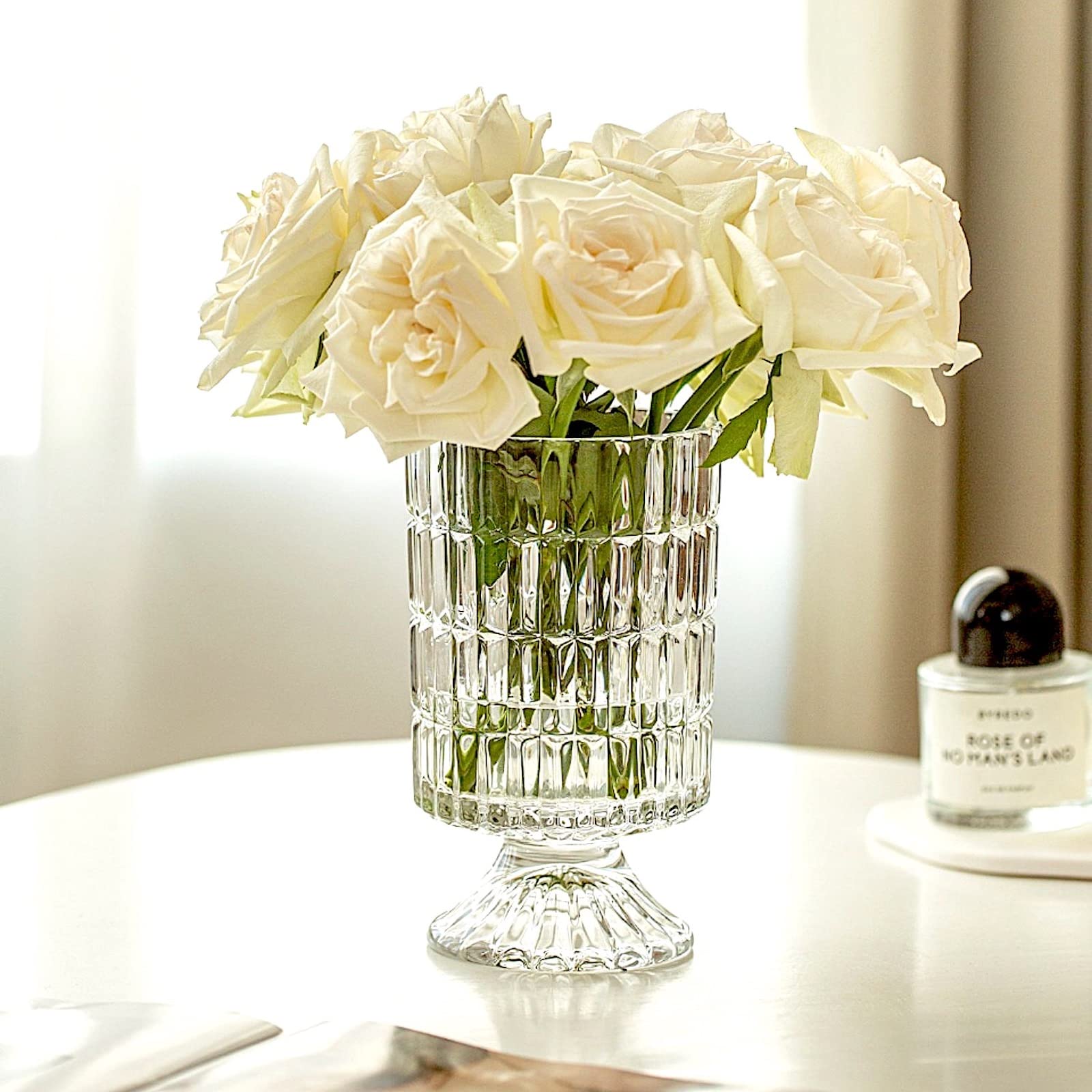 BLOFLO STU pedestal-base vase emphasizes a sturdy, premium presence for arrangements.